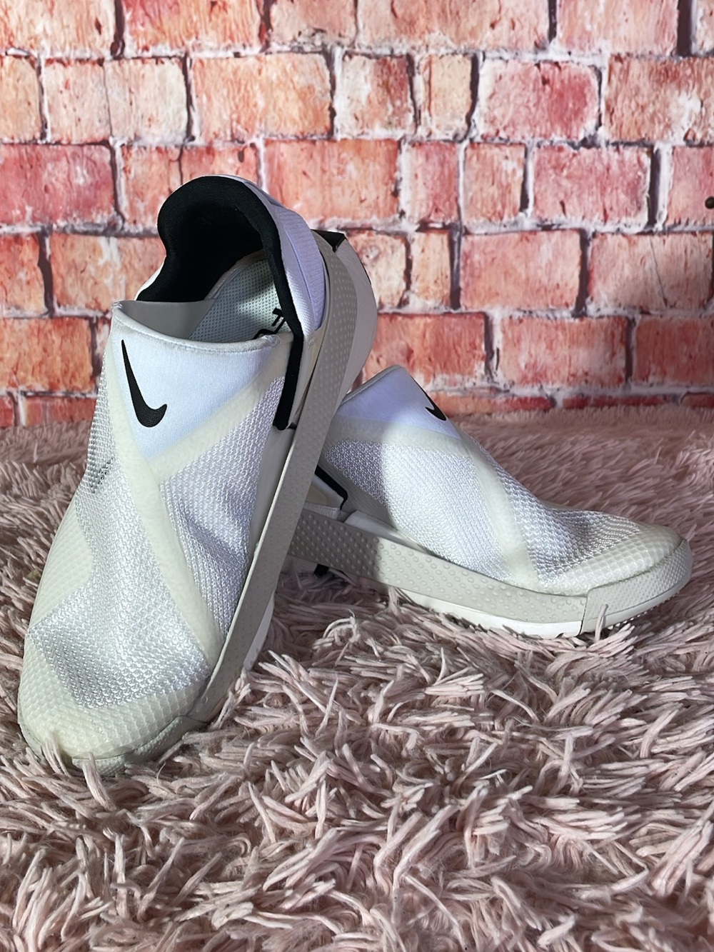 Nike White Slip-On Sneakers with Black Swoosh